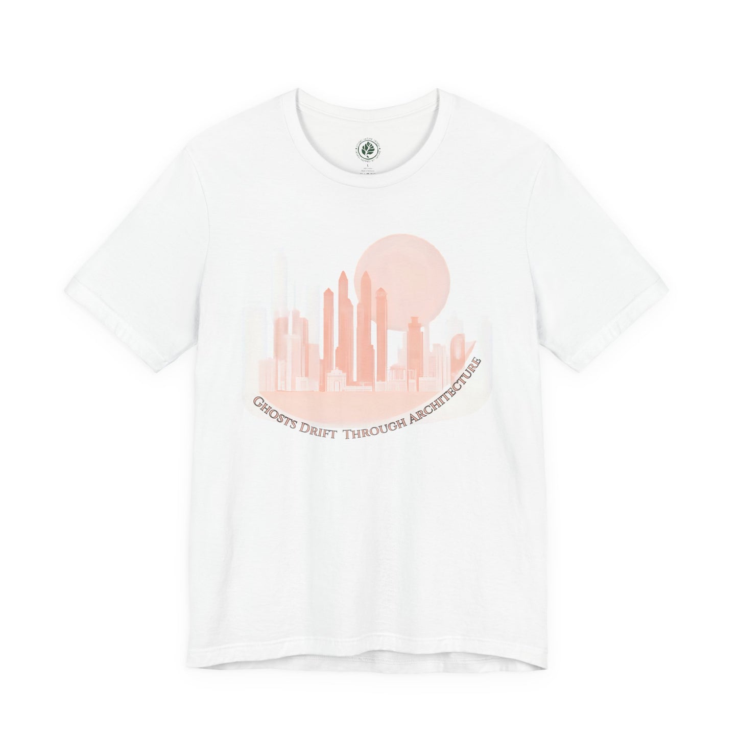 Unisex white t-shirt featuring a coral city skyline with the text “Ghosts Drift Through Architecture” beneath, symbolizing poetic urban design.