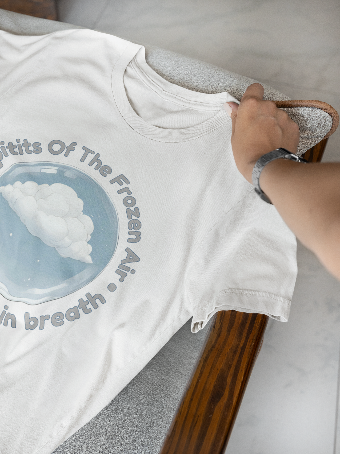 Soft cotton winter apparel with whimsical cloud artwork and graphic design on a cozy wooden frame armchair