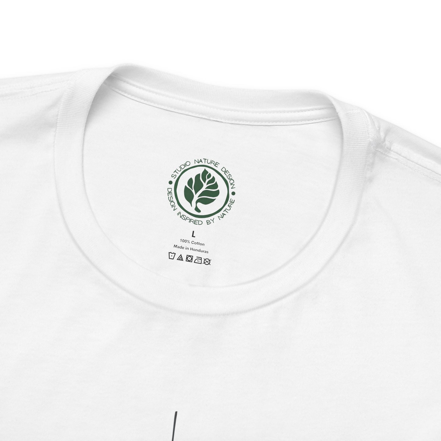 White t-shirt with a Studio Nature Design logo and text on the collar area