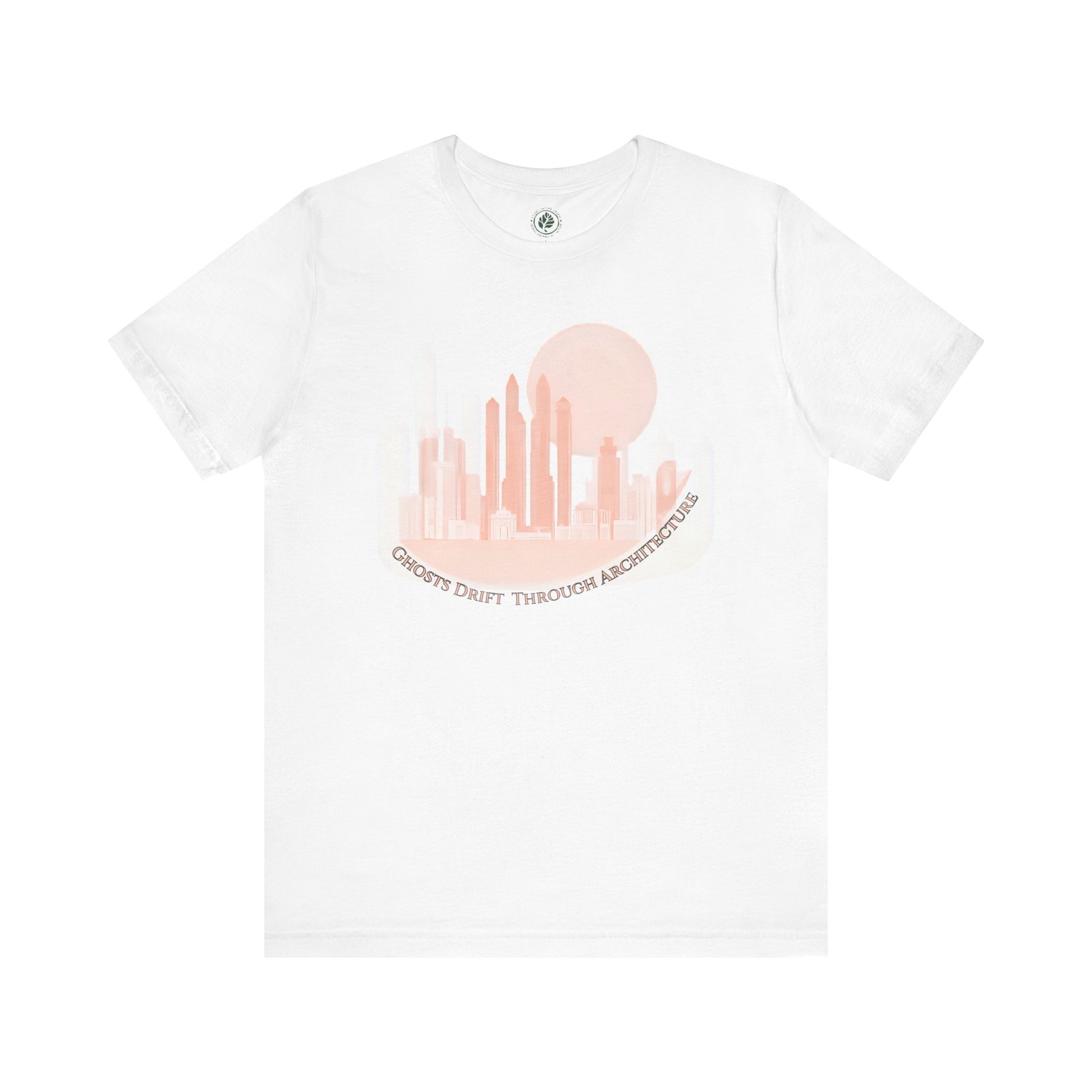 Unisex white t-shirt featuring a coral city skyline with the text “Ghosts Drift Through Architecture” beneath, symbolizing poetic urban design.