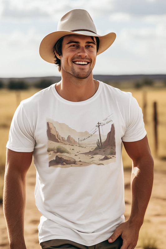 Man wearing a white t-shirt with telegraph poles and witty caption “I’d walk a mile for water… or just order delivery.” and a cowboy hat in a desert setting