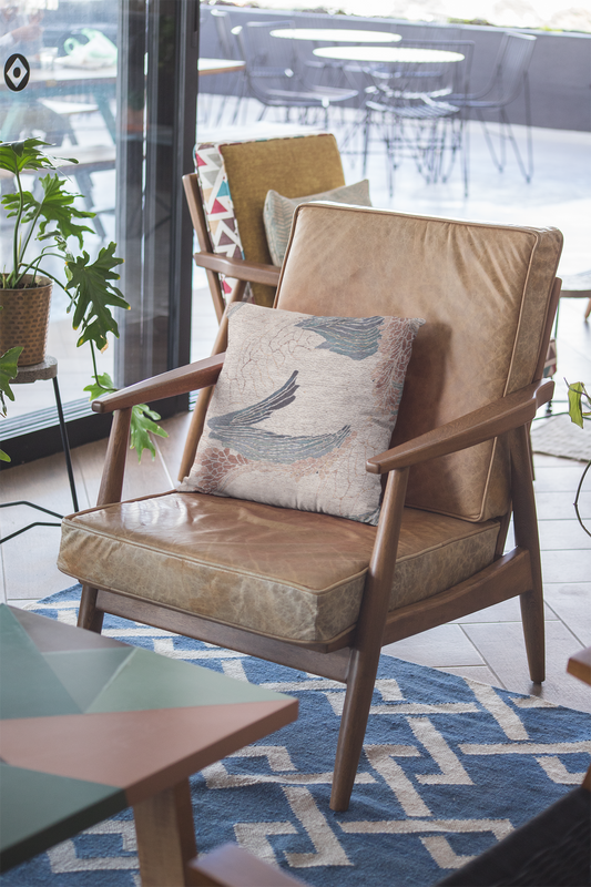 Bohemian woven pillow in cotton-poly blend with nature-inspired design, shown in double-sided print; ideal for cozy, elegant, and artistic home decor.
