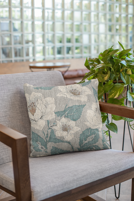 Woven pillow with soft floral design in natural tones, shown in a cozy minimalist interior; ideal for boho, nature-inspired, and calm home decor styles.
